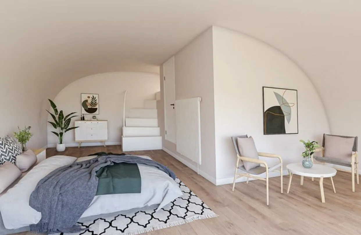 Slaapkamer na renovatie met gewelfd plafond